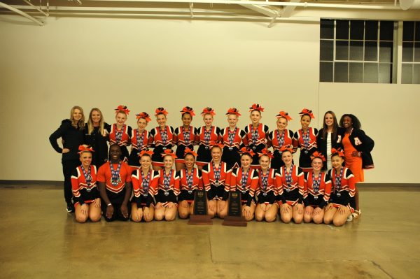 State competition group poses for a picture after their victory at state cheer.   Photo by Ethel Navarro